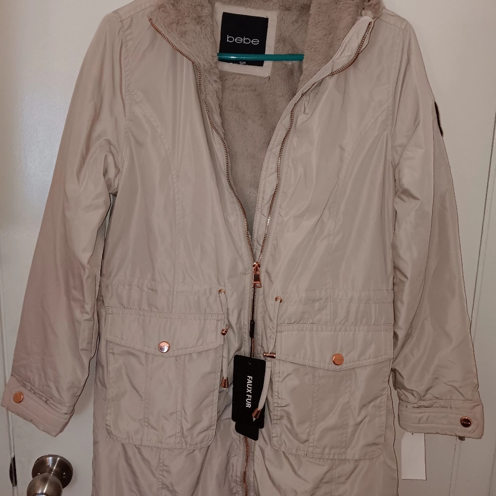 women's tan BeBe fur lined winter jacket size small.